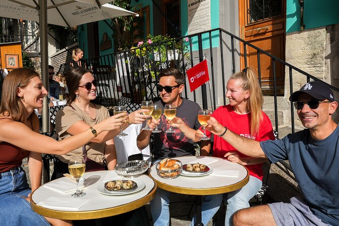 Champagne & Oysters Paris Food Tour - Le Marais is the right neighborhood for this kind of tour