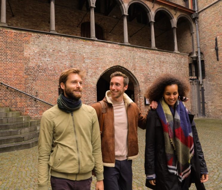 From Paris: Bruges Guided Tour with Hotel Pickup - Traditional village walk and visitor center time: what these stops really do