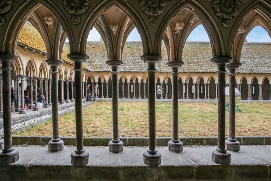 From Paris: Mont Saint-Michel Tour with Hotel Pickup Service - Inside the Gothic spaces: cloister, refectory, and what to notice