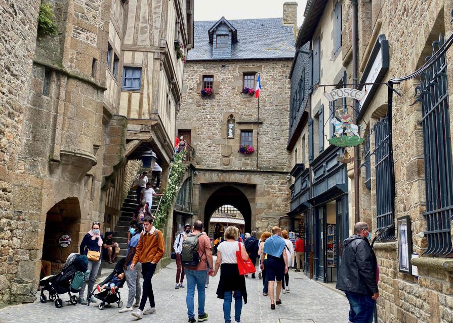 From Paris: Private Mont Saint-Michel & Normandy D-Day Tour - Walking the medieval village and reaching the Abbey