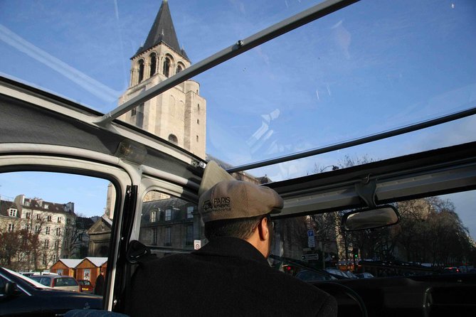 Half day trip in Paris in a vintage and convertible car with a Parisian - The Citroën 2CV experience, minus the tourist bus vibe