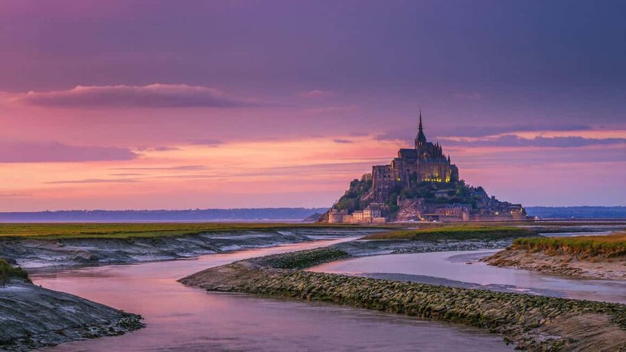 Mont Saint-Michel Small-Group Day Trip from Paris with Abbey Ticket - Crossing to the Fortified Village: Where the Story Becomes Visible