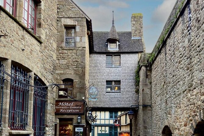 Mont Saint-Michel with Calvados Tasting Private Tour from Paris - Reaching Mont-Saint-Michel and entering the medieval village