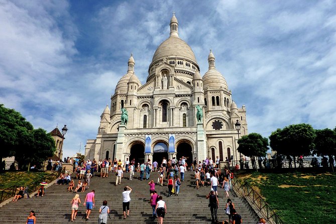 Montmartre Hidden Gems and Scenic Highlights Walking Tour - The man-who-walks-through-a-wall sculpture, then Dalida’s quiet tribute
