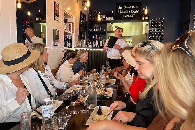 Montmartre Hill French Gourmet Food and Wine Tasting Walking Tour - Le Mur des Je taime and Place du Tertre: art made human