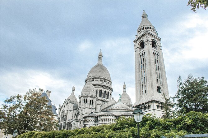 Montmartre: Secret Stories of Paris - Self-Guided Audio Tour - Stop 3: Église Saint-Pierre de Montmartre, older than the basilica vibe