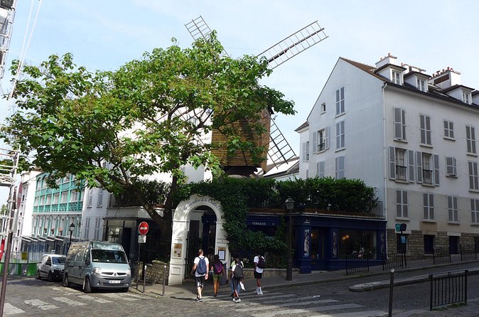 Montmartre Walking Tour: A Journey Through Art and History - Meeting at Place Blanche, then easing into the real Montmartre
