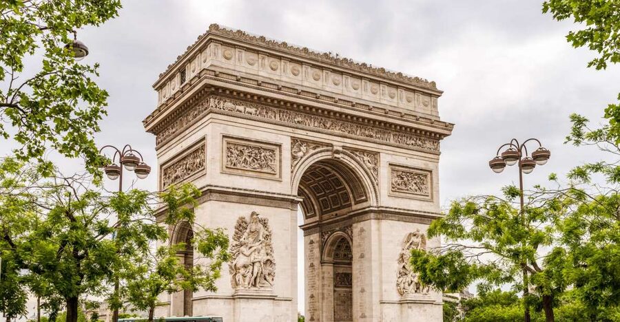 Paris rooftops and the Champs-Élysées seen from the Arc de Triomphe