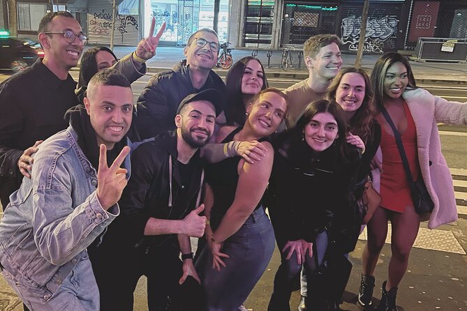 Paris: City Center Guided Pub Crawl with Shots & Club Entry - Your night route: first bar, Porte-Saint-Denis photo stop, and the Châtelet finale