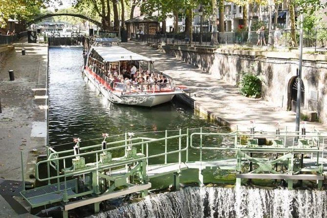 Paris: Cruise on The Canal Saint Martin and The Seine River - Swing bridge and canal life that feels like Paris in miniature