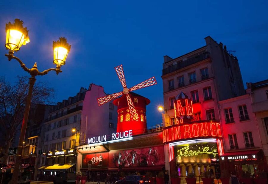 Paris: First Show Moulin Rouge with Champagne & Seine Cruise - Moulin Rouge Féerie revue: can-can, chorus, costumes, and champagne