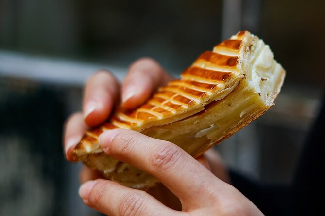Paris: Notre Dame Gourmet Food & Wine Tour with a Culinary School - Rue Saint-Antoine, Eglise Saint-Paul-Saint-Louis, and a chou à la crème hit