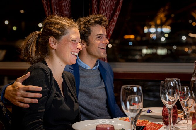 Paris Seine River Dinner Cruise by Maxim's with Champagne & Music - Dinner on board: Champagne aperitif, two service times, and menu options