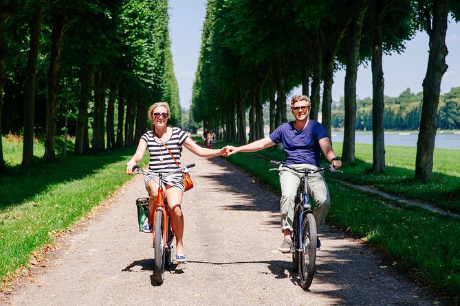Versailles Full Day Bike Tour with Palace, Gardens, & Picnic - Stop 1 and 2: cruising Versailles town parks, then shopping for lunch
